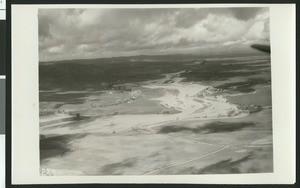 Aerial view of flooding of the Santa Ana River near Colton, showing flooding over roads, ca.1930