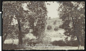 View of rustic bridge over trout steam in front of hotel, San Luis Hot Sulphur Springs, San Luis Obispo County, California, ca.1906