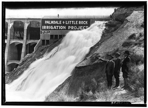 Three men standing in front of Little Rock Dam near Palmdale, April 11, 1926