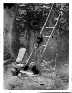 Naked Hopi Indian boy with bow and arrow, 1903