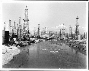 View of Venice-Del Rey Oil fields spaced along a river, September 1930