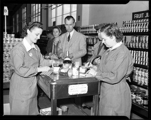 Interior view of a grocery store showing a food ration line during World War Two, ca.1941-1945