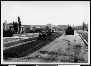 Asphalt finishing machines smoothing a street for a resurfacing project