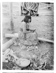 Havasupai Indian girl, Walathama's daughter, sitting outside, ca.1900