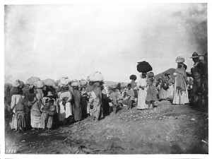 A group of more than 30 Yaqui Indian prisoners being escorted away by Mexican soldiers, Mexico, ca.1910