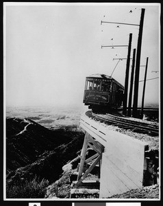 Mount Lowe Railway car on circular bridge, 1915