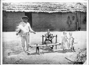 Agua Caliente Indian man, Simon Cibinoat, spinning Yucca fiber into yarn, 1903