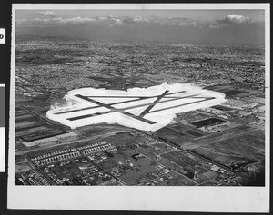 Aerial view of the Los Angeles International Airport facing northeast, with an emphasis on the runway, in December 1951