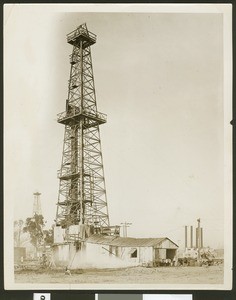 Oil rig including derrick and pump house, ca.1930