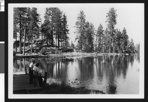 Family watching ducks in Bartlett's Cedar Lake, ca.1950