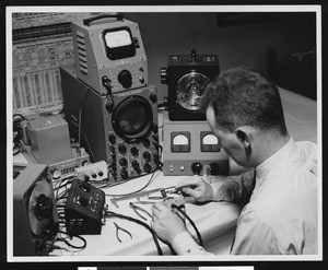 Male electronics worker and apparatus, ca.1950