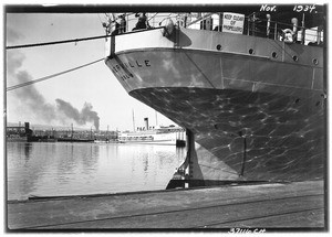 Close-up of hull of a ship against a dock, Los Angeles Harbor, November 1934