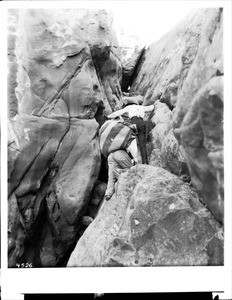 Two Acoma Indian men climbing up the Acoma Trail, 1886