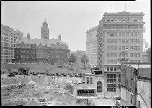 View of the City Hall construction site with the old courthouse in the background, Los Angeles, 1926-1928