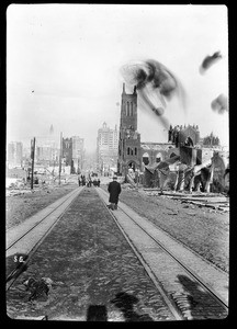 View of a street in California, showing earthquake damage to a church on the right