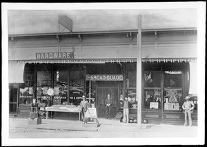 Exterior view of E.C. Fisher's store on the west side of South Main Street, north of Washington Boulevard in Los Angeles, ca.1890