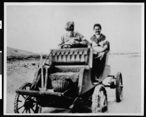 Ezra Hamilton with his grandaughter Harriett Rich in Antelope Valley's first automobile, a 1903 St. Louis, 1900-1909