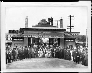 Group portrait of Shriners posing in front of an Egyptian gateway in Long Beach, ca.1890