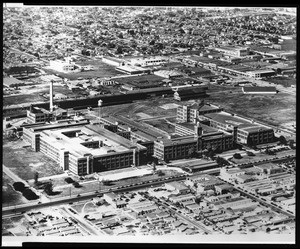 Birdseye view of the Goodyear Tire and Rubber Company factory, showing surrounding residential area, ca.1930