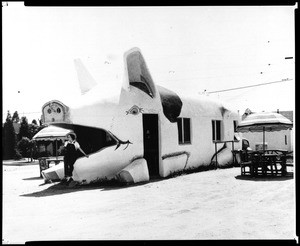 Exterior view of a pig-shaped restaurant, 1920-1929