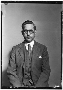 Portrait of Arche M. Dunning posing for his passport, October 1932