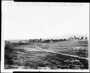View of the town and mission of San Juan Capistrano from a hill north of town