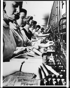 View of operators at the General Telephone Company switchboard, 1940-1950