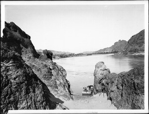 Flat boat moored in Needles Canyon, on the Colorado River, 1900-1950