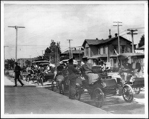 Cars decorated with banners on Broadway at Ninth Street looking south from Eighth Street, July 1, 1903