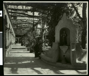 View of the courtyard of Frank Miller's Glenwood Mission Inn in Riverside, showing St. Francis Shrine, ca.1910