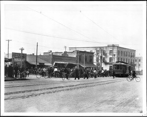 A bicycle parade for Griffith Park on Main Street at Ninth Street, Los Angeles, 1904