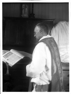 Father Reposo reading at Mission San Jose de Guadalupe, 1904