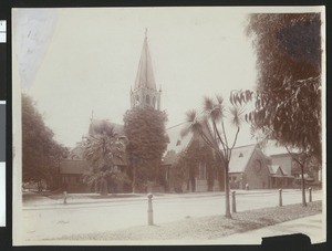 Exterior view of Trinity Church from a park in San Jose, California, ca.1900