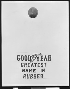 Balloon with a sign advertising the Goodyear Tire and Rubber Company, ca.1930