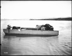 Small outboard stranded on a sandbar in the Colorado River, ca.1900