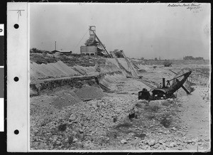 Consolidated Rock Products digging in a rocky trench, 1929