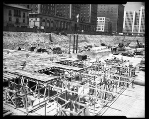 Low wooden framework being built during the construction of City Garage in Pershing Square, Los Angeles, 1951