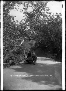 People in an open automobile on Topanga Road in Garrapattas Canyon, ca.1915