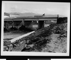 Flood damage to Warner Brothers Studio and a bridge, 1938