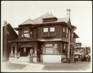 Exterior view of a Craftsman-style residence on the corner of Sixth Street and Burlington Avenue in Los Angeles