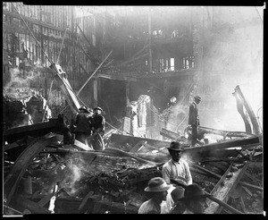 Men sifting through rubble of L.A. Times offices after bombing, October 1910