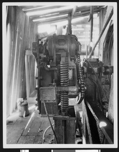 Slow speed pump unit, an electric motor that drives the pumping unit, Santa Fe Springs Oil Field, ca.1931