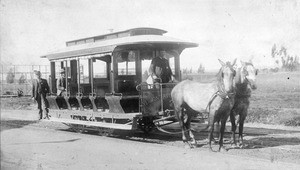 View of a Vermont Avenue horsecar on tracks in front of an empty lot, ca.1886