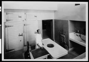 Staff member in the Autopsy Room off Laboratory 580, Los Angeles County General Hospital, ca.1925