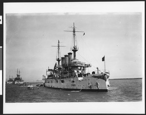 Starboard view of the U.S.S. Connecticut, showing several boats alongside and other ships astern, 1908