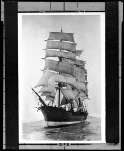 Three-quarter bow view of a fully rigged ship sailing out from San Diego, ca.1904