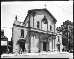 Exterior view of Saint Vibiana's Cathedral (Saint Mary's Church), showing pedestrians in front, ca.1922-1935