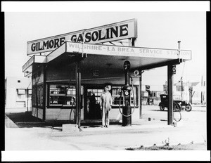 Exterior view of the Gilmore Gasoline station, located at the intersection of Wilshire and La Brea, ca.1920