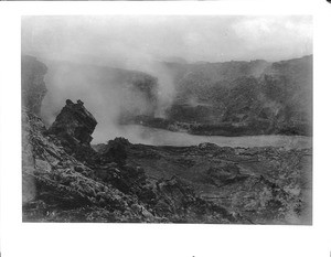 Volcano Kilauea, Hawaii, showing flow(?) and steam, 1907
