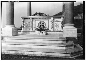 Close-up of the front of a grave within a pagoda style sepulchral monument on the grounds of Forest Lawn, ca.1930